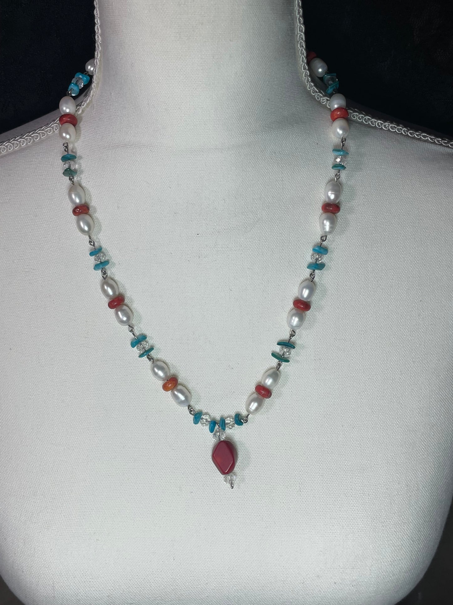 Coral, pearl, and teal shell necklace with coral dangle