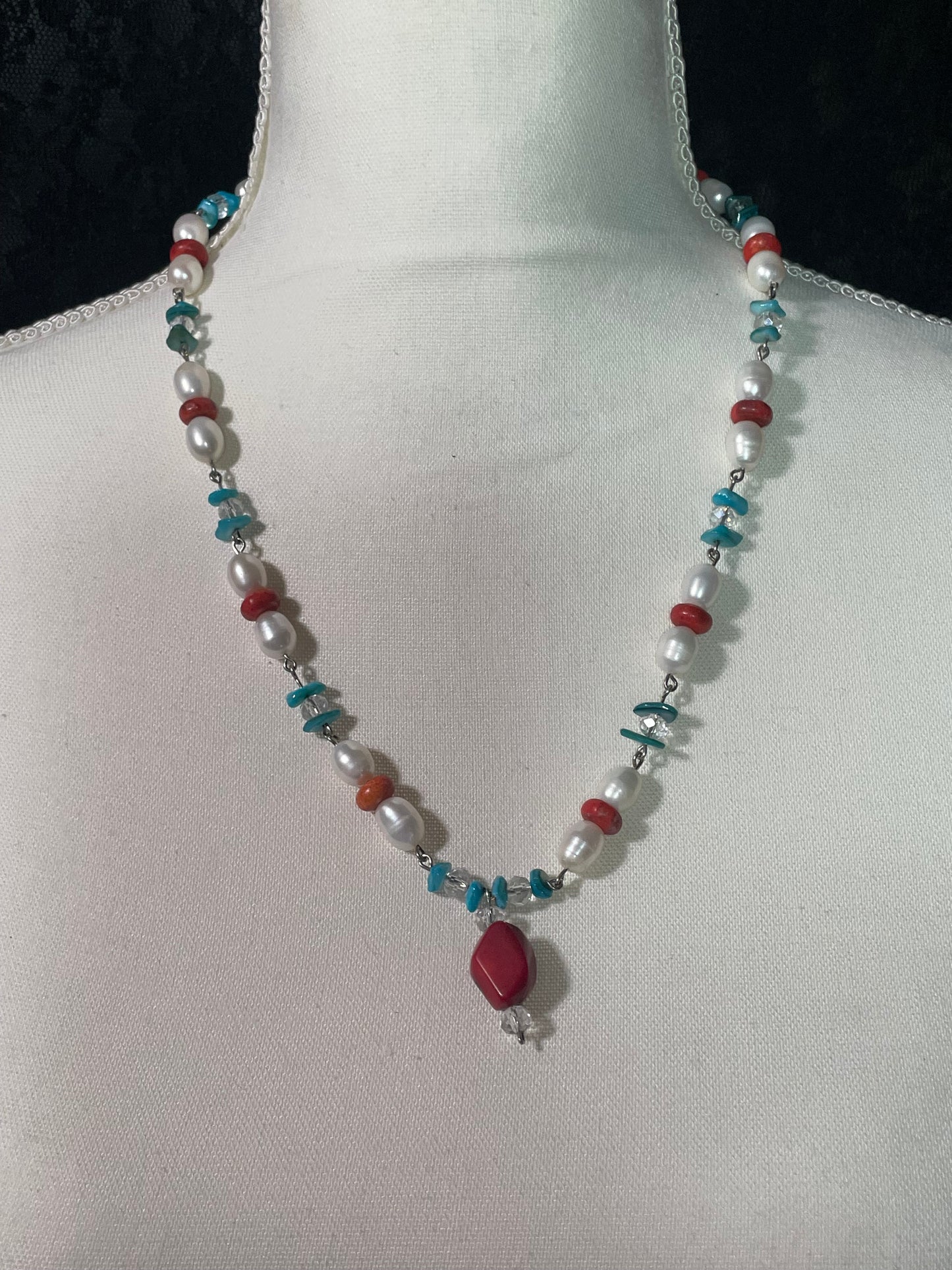 Coral, pearl, and teal shell necklace with coral dangle