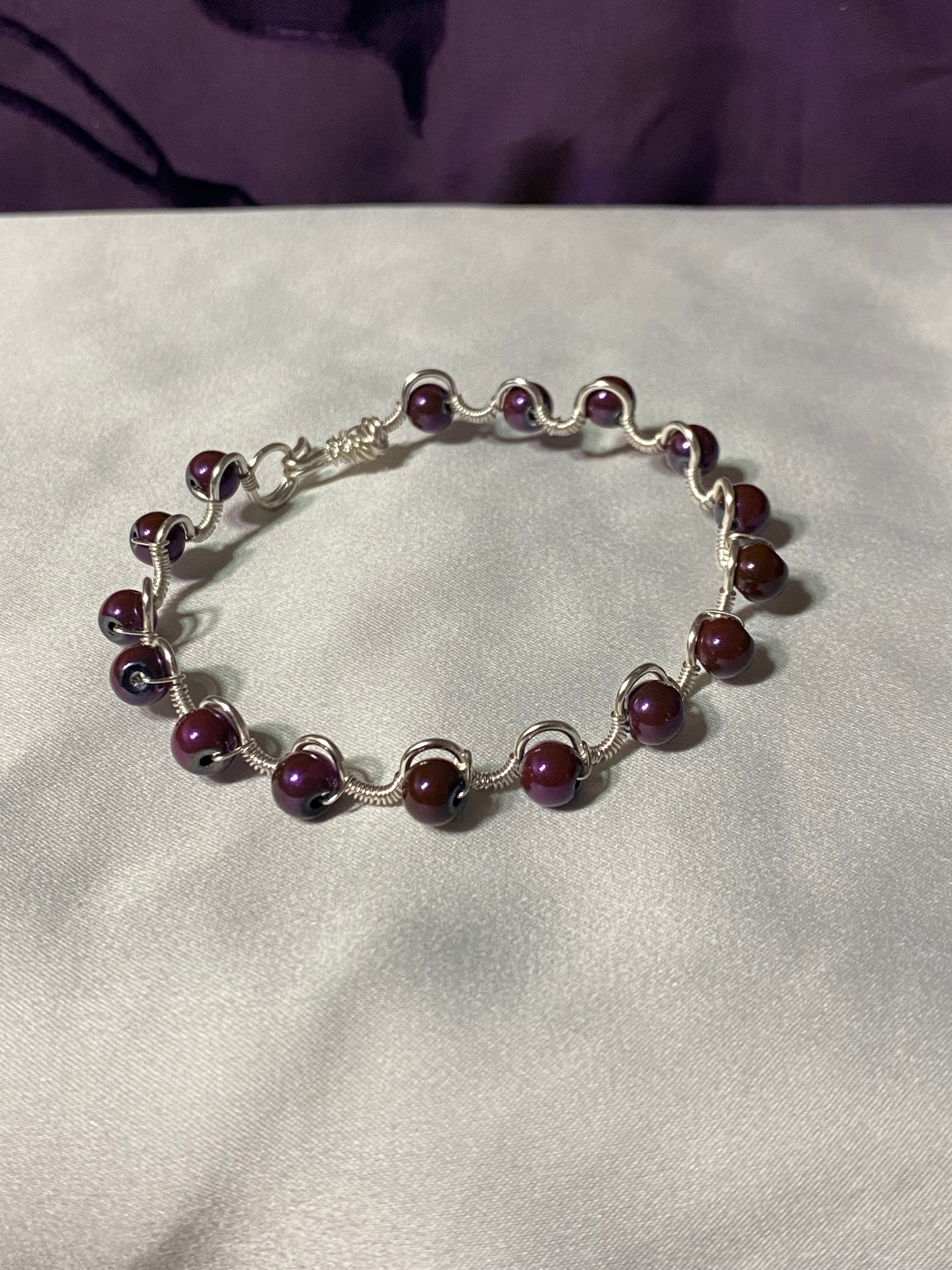 Delicate purple and silver tone bracelet