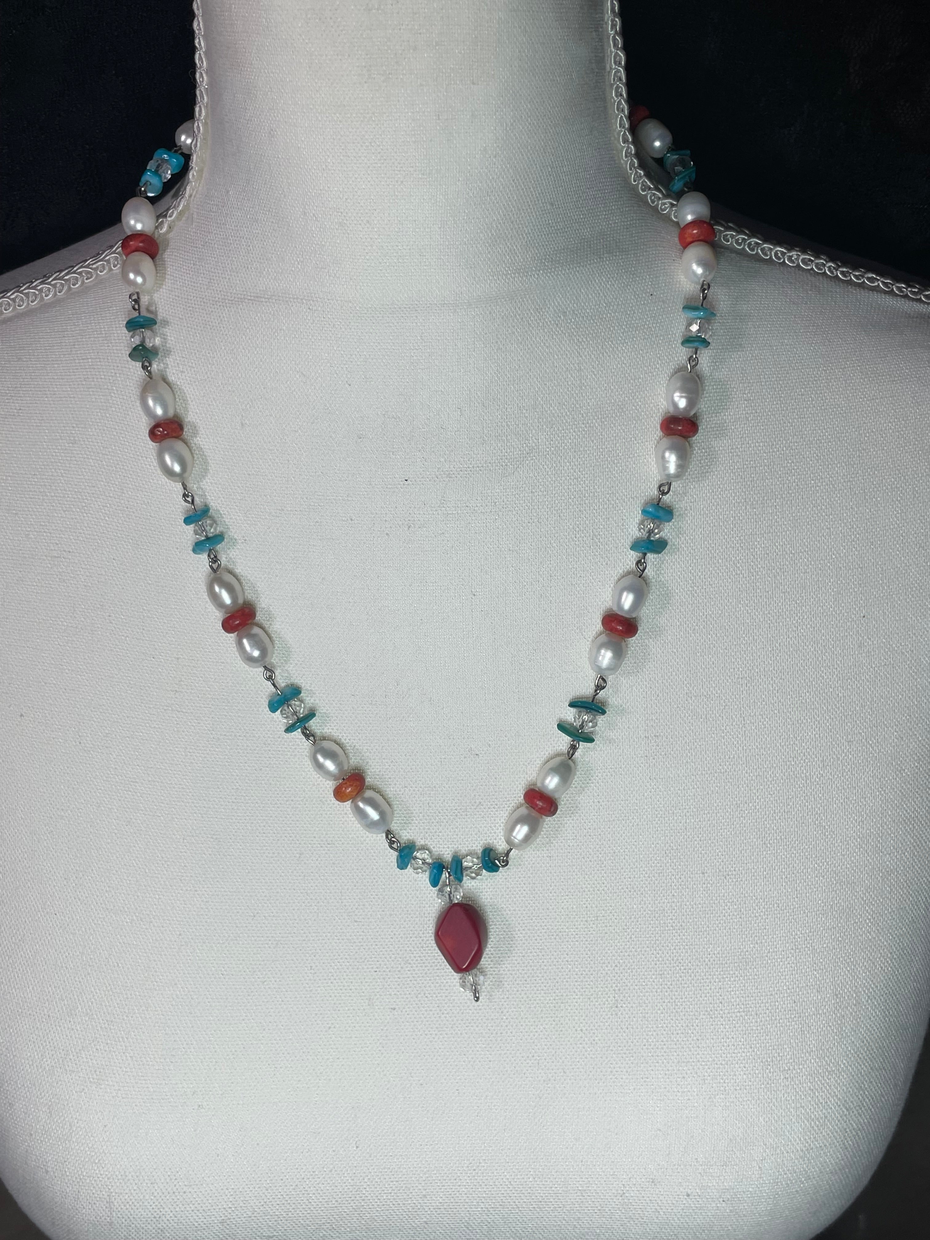 Coral, pearl, and teal shell necklace with coral dangle
